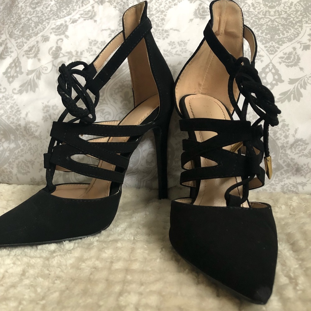 Black suede strappy pumps.